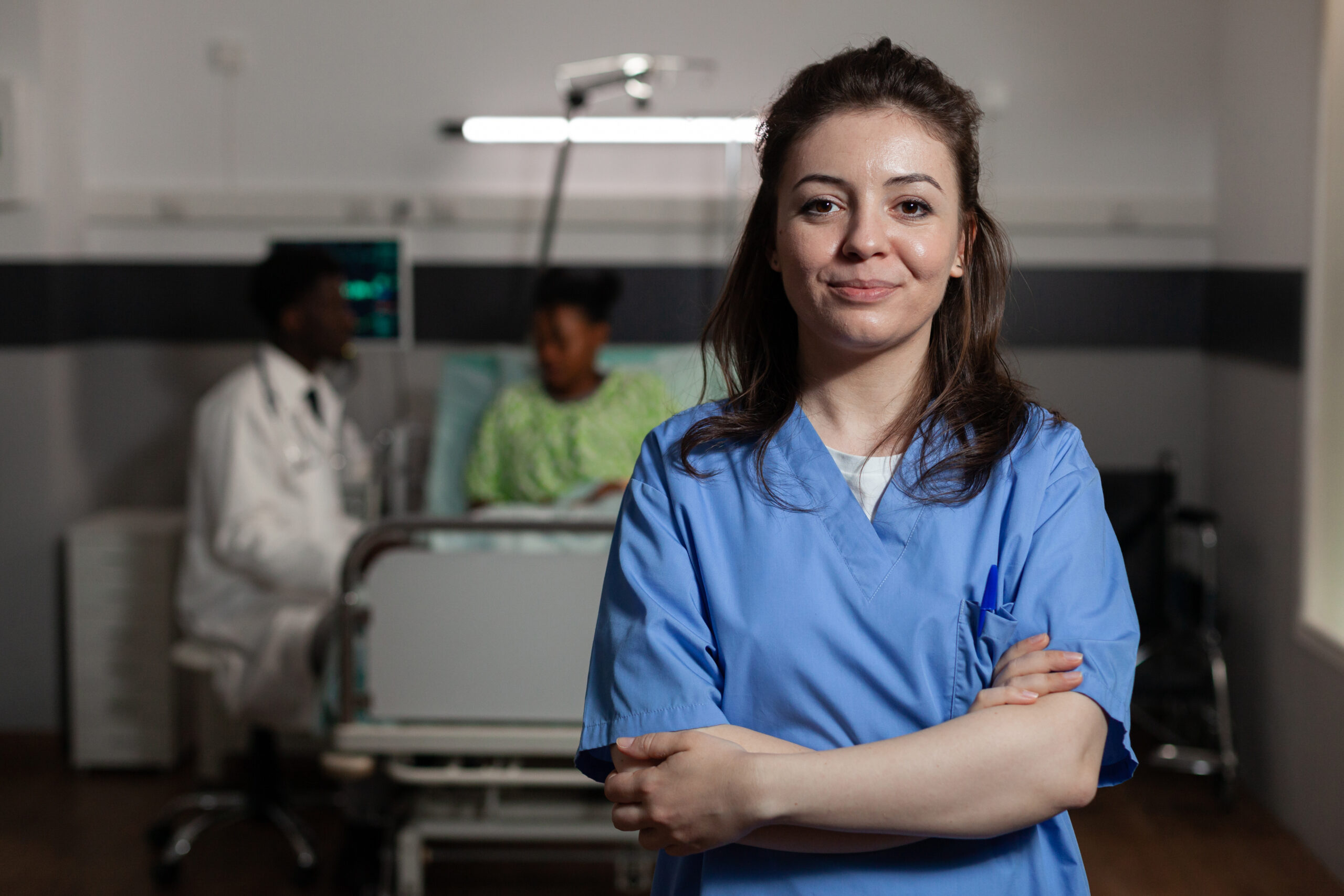 specialist physician assistant standing in hospital ward during medical consultation - Per Diem Nursing