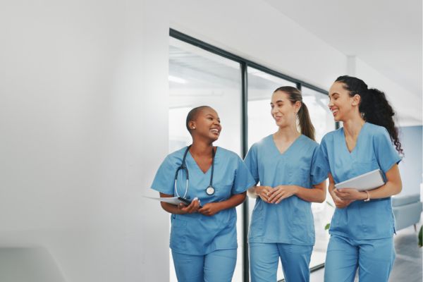 Healthcare professionals collaborating to improve workforce retention in hospitals and clinics